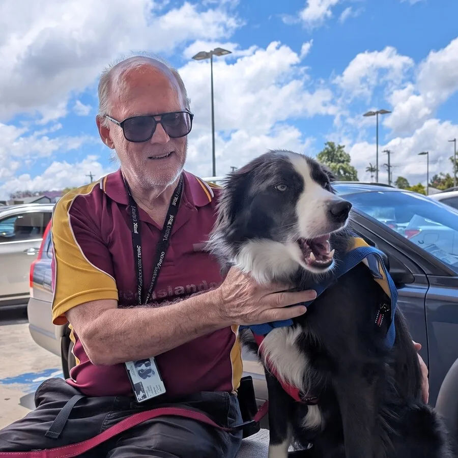Brian Colyer with Porter, his assistance dog, in a car park on the Western Downs